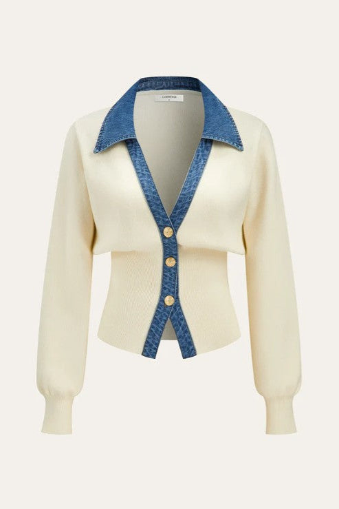 Cream-colored cardigan with blue denim collar and buttons on a white background